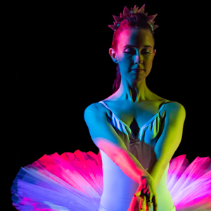 Ballet dancer with rainbow stage lights